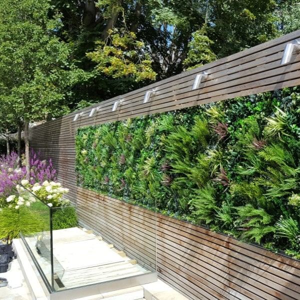 Privacy Fence Constructed with Fake Plant Panels Makes Beautiful Oasis